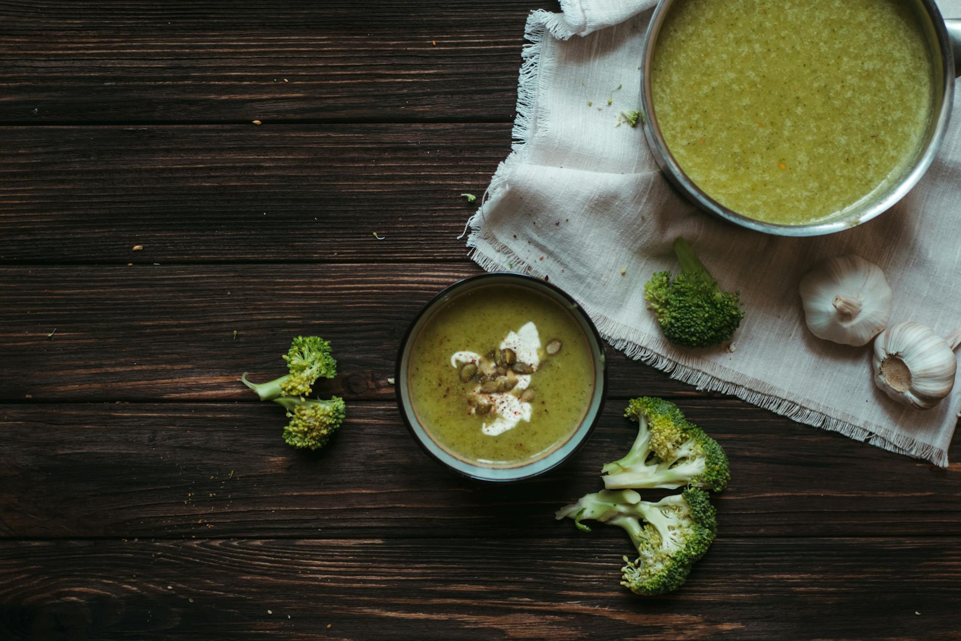 broccoli and garlic soup with cloth on table